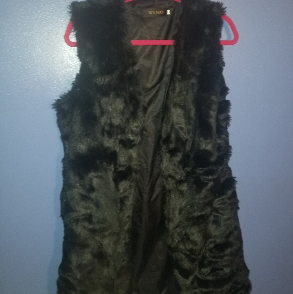 Mid length faux fur vest.